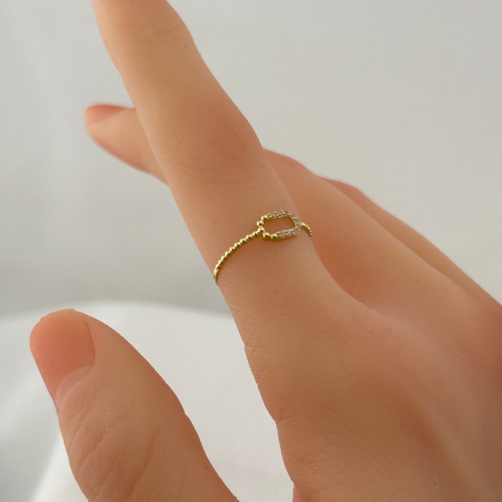 IMG_2010 خاتم ذهب عيار 18 بتصميم حبة ذهب مرصعة بزركون من جولدانا