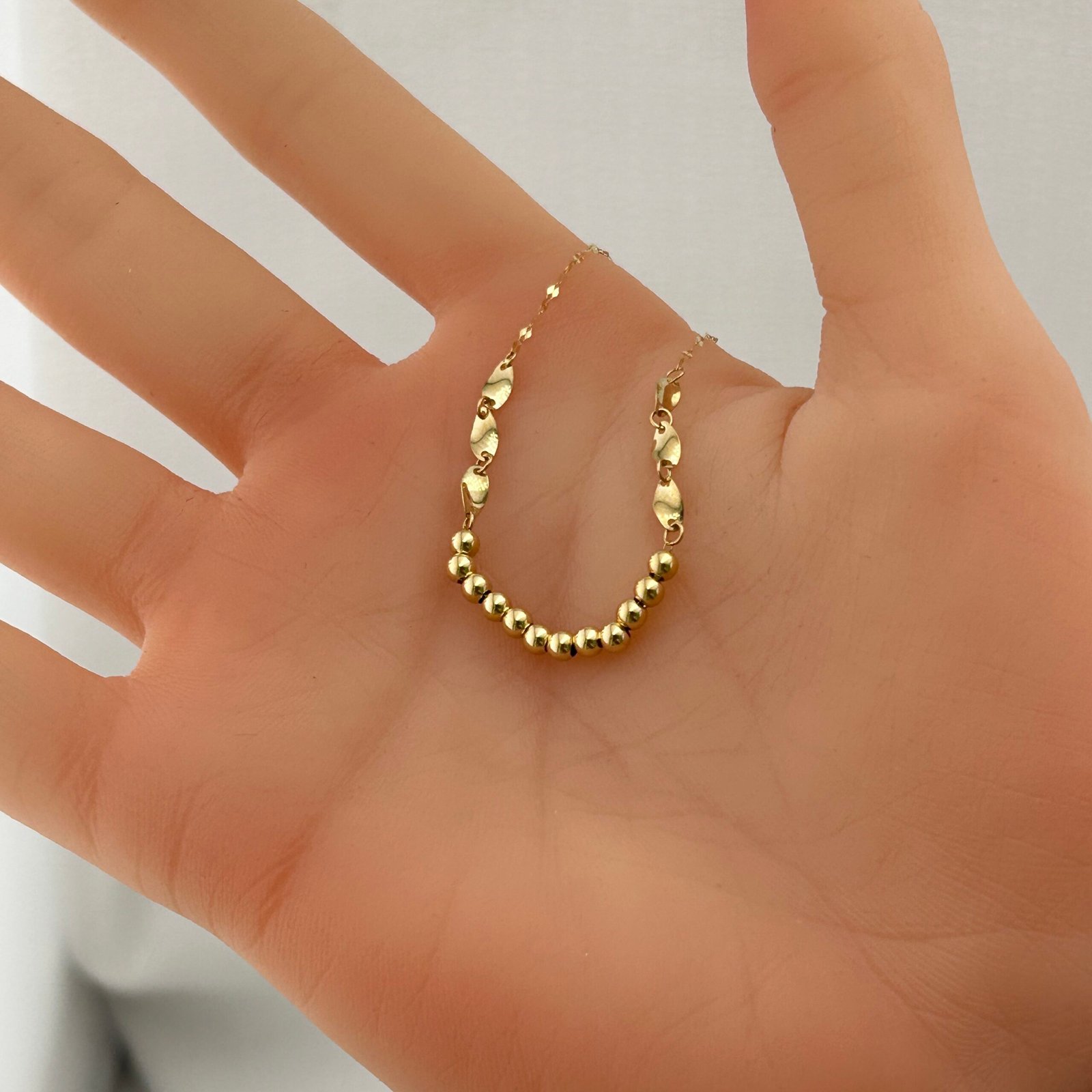 IMG_2773 تعليقة ذهب عيار 18 بكرات ذهبية وحلقات زخرفية تصميم إيطالي من جولدانا